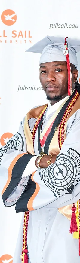 Tyshawn Jamison in graduation regalia